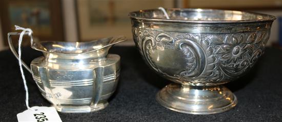 Late Victorian embossed silver pedestal bowl and a silver cream jug